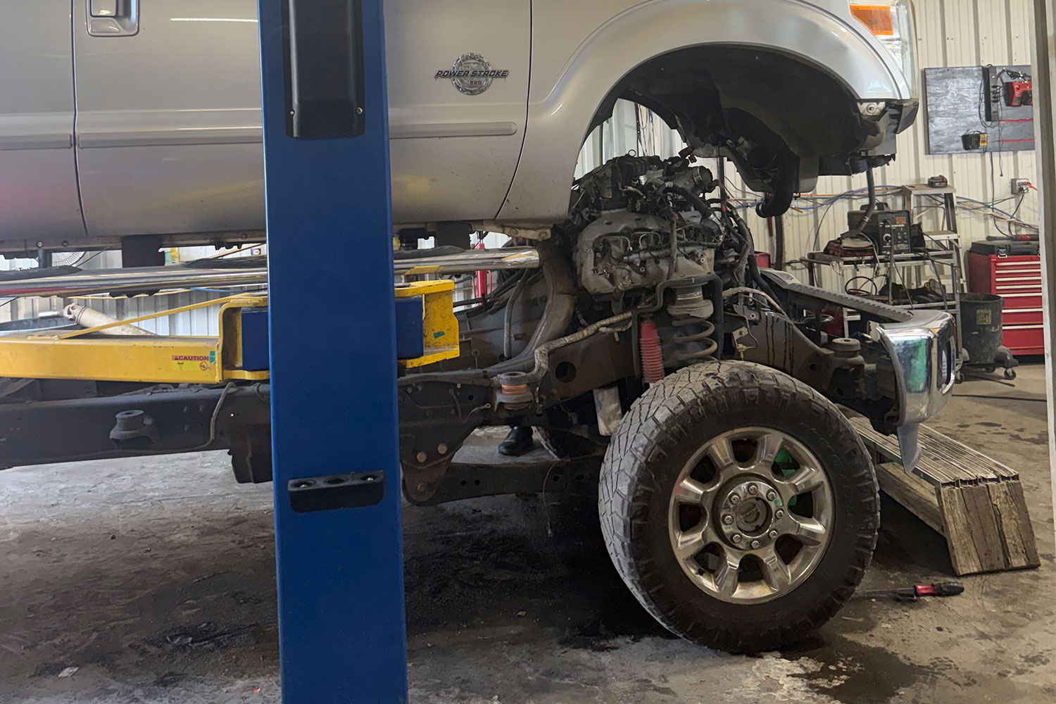 Diesel engine work underway on a work truck at South-End Automotive and Diesel