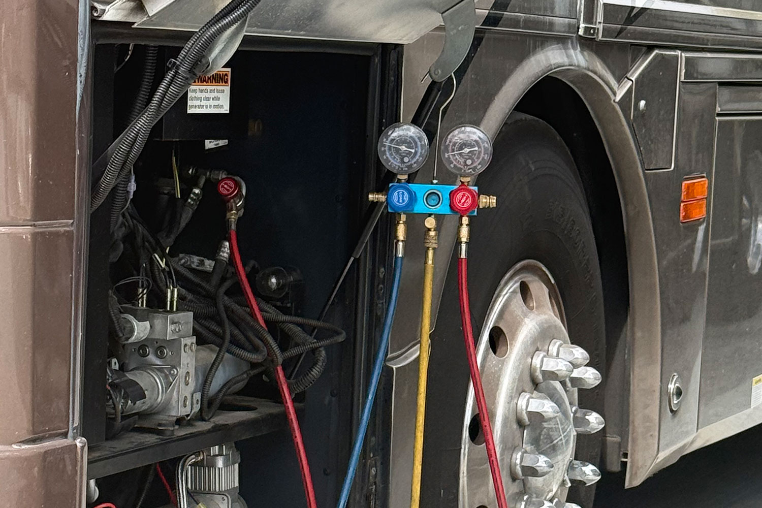 Technician carrying out a pre-trip inspection on a motor home